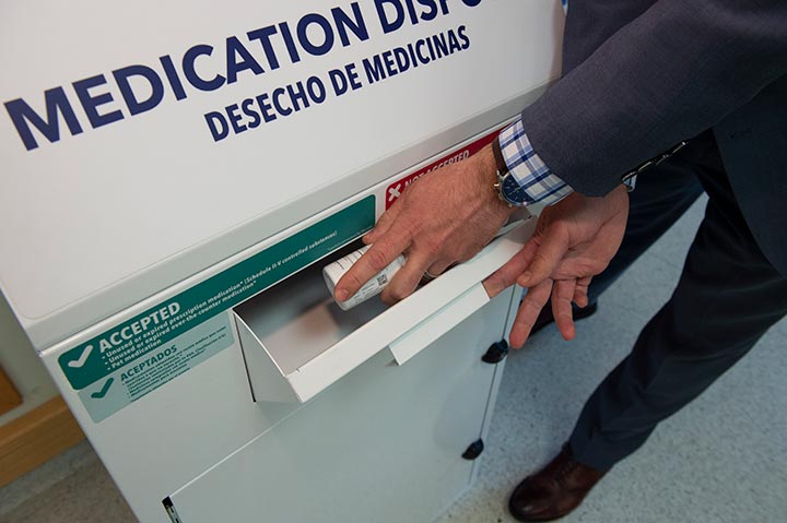 an individual disposing of their expired medication